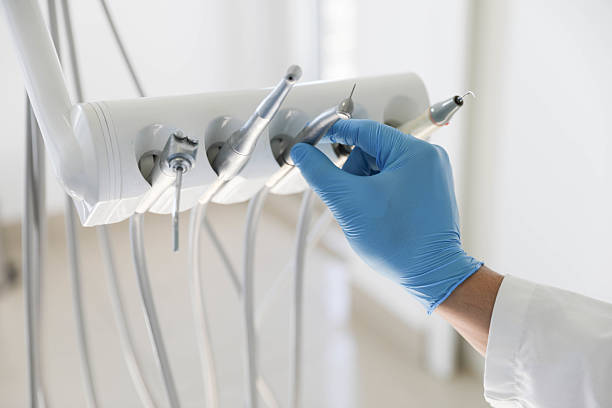 Professional Tooth Extraction technician working in Hughes Springs, TX